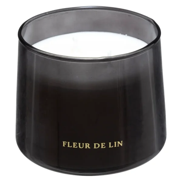 Une bougie parfumée "Bili" Fleur de Lin, présentée dans un élégant récipient en verre noir mat